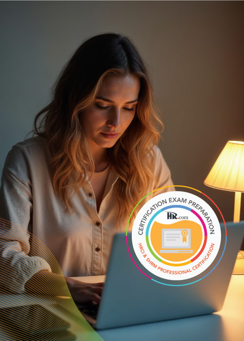 professional woman in her 30s, a person of color, focused on her laptop while a guiding light shines beside her, symbolizing ethical decision-making for recertification courses.