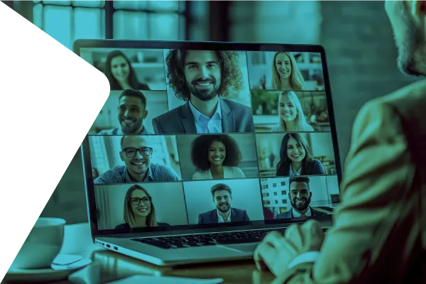 Person viewing a virtual meeting on a laptop screen with a grid of smiling speakers in an online event setting.