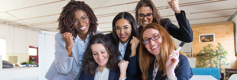 5 people celebrating sucess at work at a office space