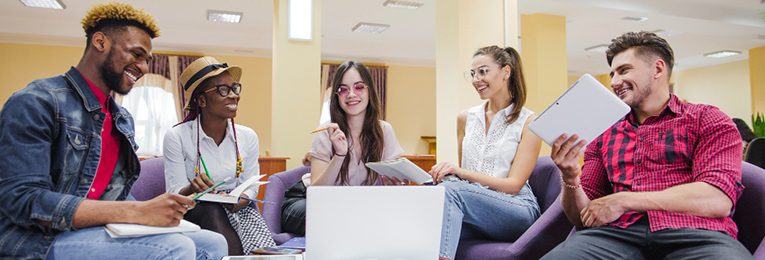 five people at a casual discussion at a office space