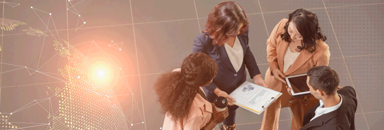 four people seen at a casual discussion at a office space